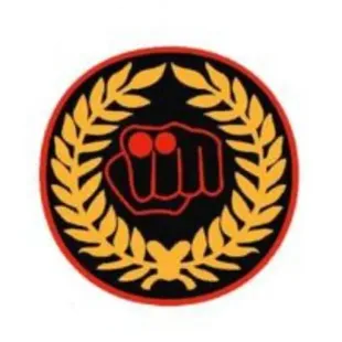 Okinawa Goju Ryu Karate Do Shobukan India Logo - Fist in Red Outline Encircled by Golden Laurel Wreath on Black Background